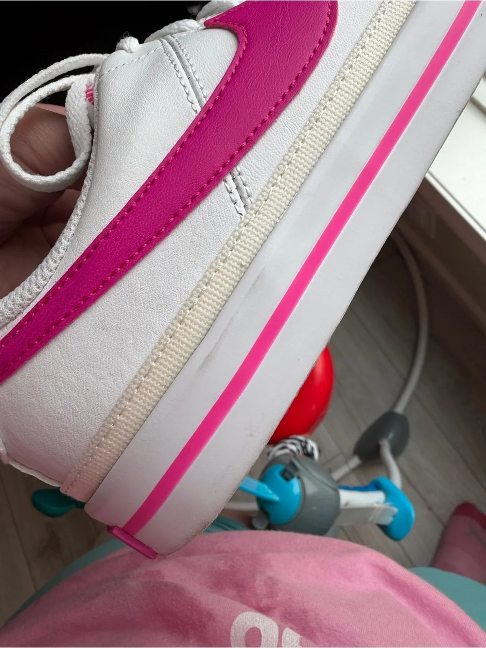 Nike White Sneakers with Pink Swoosh and Accent Stripe
